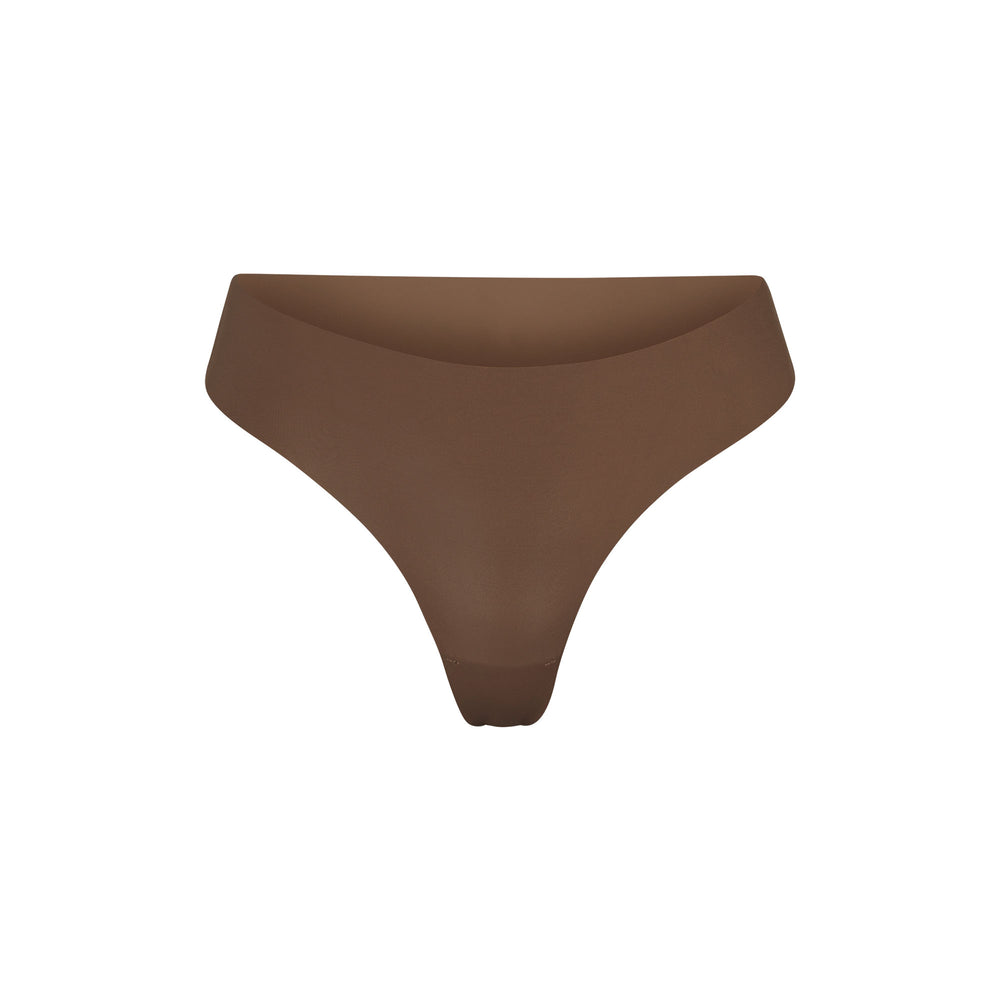 Skims FREE CUT MID WAIST Thong Abrikoos | DWV-312657