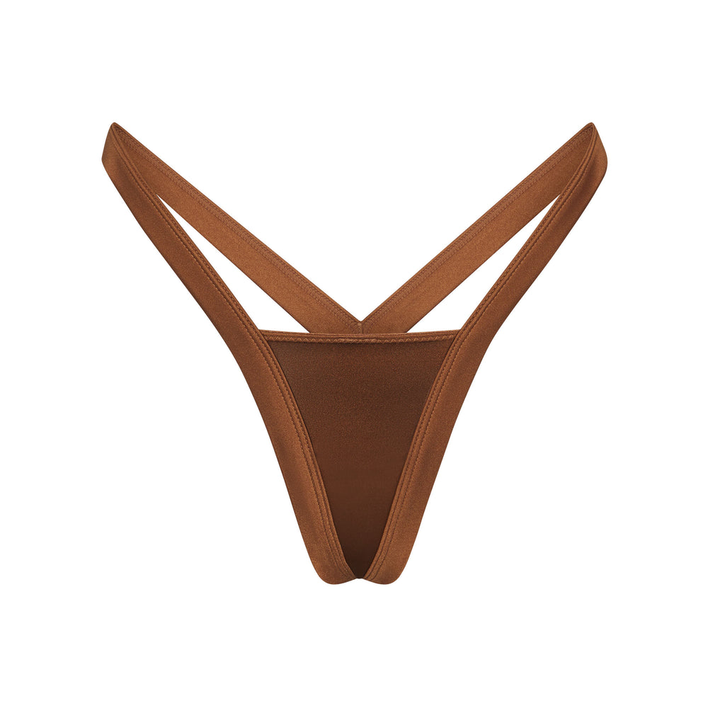 Skims STRETCH SATIN BUTTERFLY Thong Abrikoos | OUT-509647