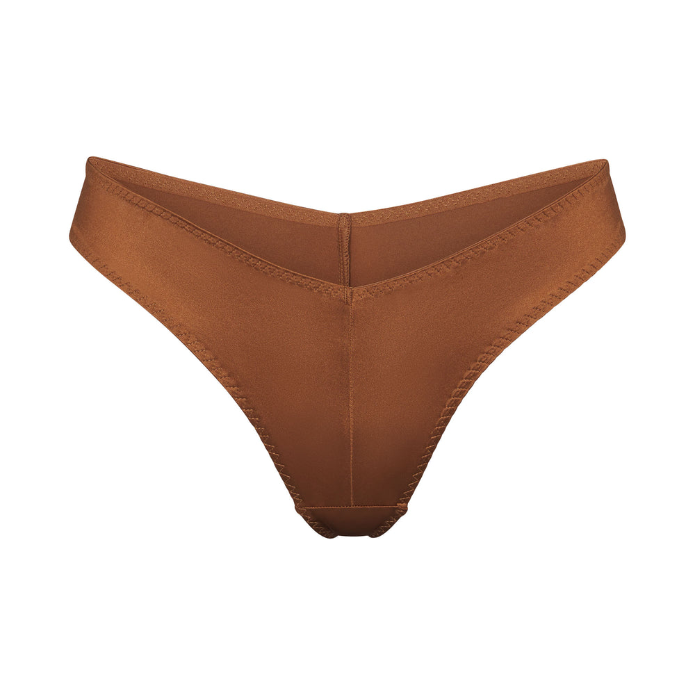 Skims STRETCH SATIN CHEEKY Tanga Abrikoos | IKT-038692